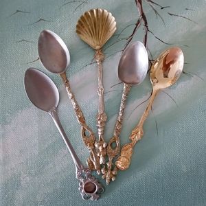 A collection of Intricut  Spoons Spring Tea
